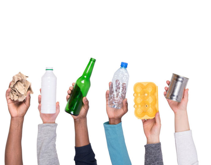 Recyclable,Rubbish,Held,In,Hands,Isolated,On,White,Background